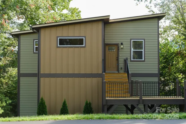a side view of a house with a yard