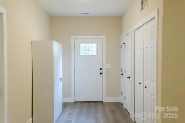 a view of an empty room with a window