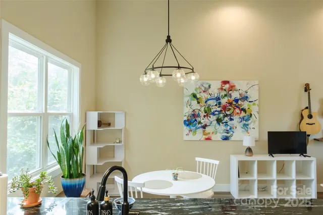 a room with a table and a potted plant