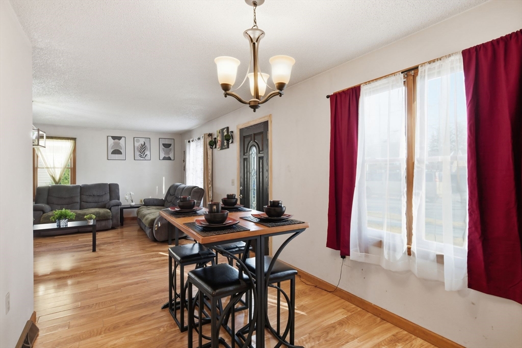 222 Edendale Street Springfield, MA 01104 - Photo 11 of 36 a view of a dining room with furniture and window
