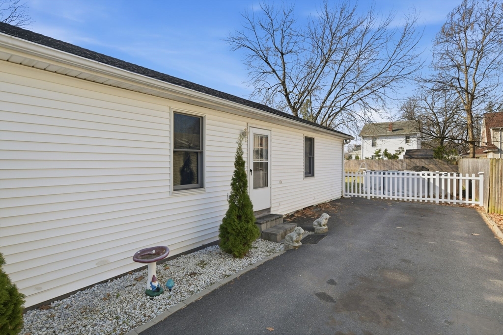 222 Edendale Street Springfield, MA 01104 - Photo 4 of 36 a front view of a house with garden