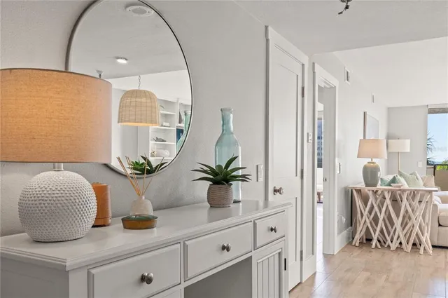 a living room with furniture and potted plant