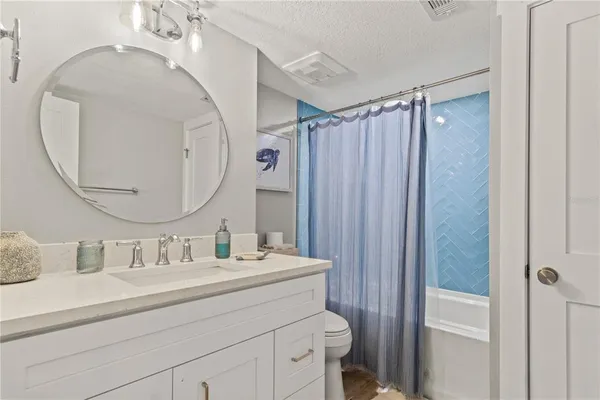 a bedroom with a bed and a table in it