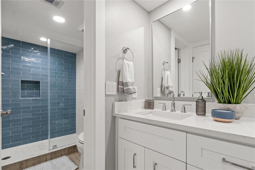 6035 Sea Ranch Drive, Unit 203 Hudson, FL 34667 - Photo 27 of 55 a bathroom with a shower sink and vanity