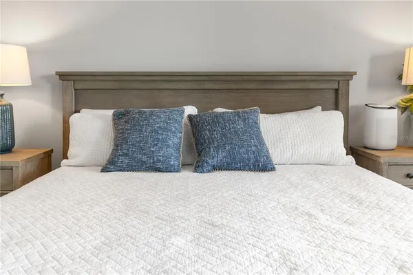 an empty room with wooden floor and a large window
