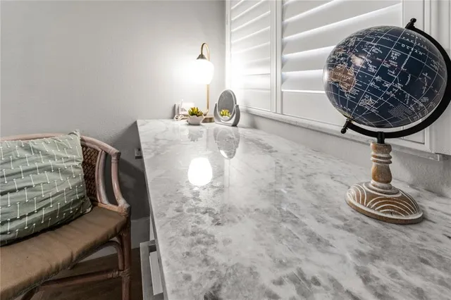 a living room filled with furniture and a flat screen tv