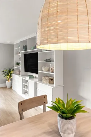 a view of a living room with furniture and a flat screen tv