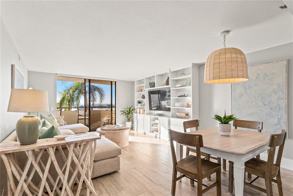 6035 Sea Ranch Drive, Unit 203 Hudson, FL 34667 - Photo 5 of 55 a living room with furniture a table and chairs