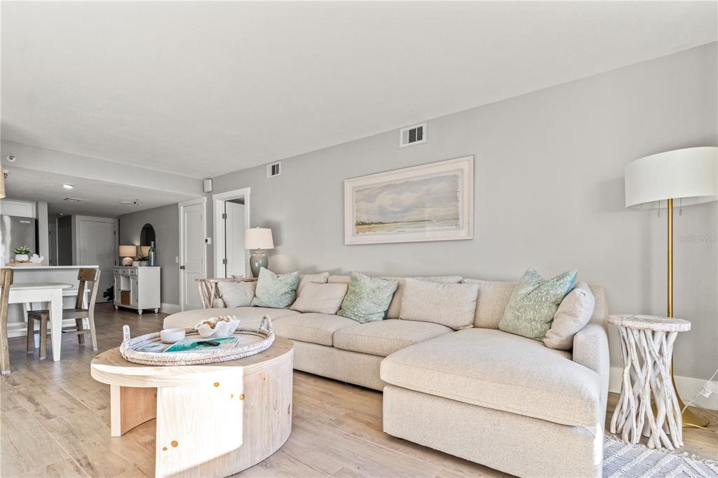 6035 Sea Ranch Drive, Unit 203 Hudson, FL 34667 - Photo 6 of 55 a living room with furniture and a table