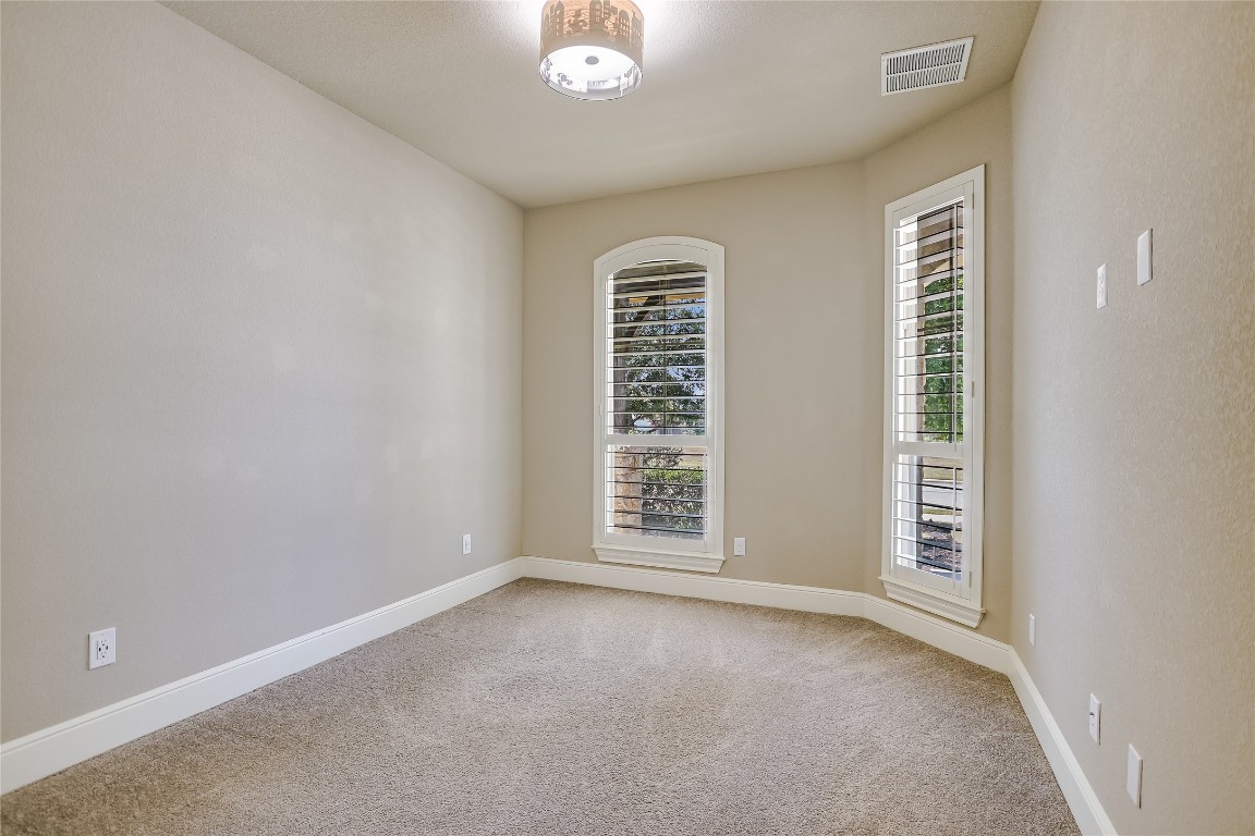 416 Cherokee Rose Circle Georgetown, TX 78626 - Photo 10 of 36 an empty room with windows