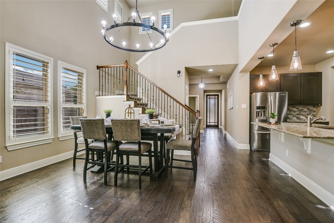 416 Cherokee Rose Circle Georgetown, TX 78626 - Photo 12 of 36 a dining room with wooden floor and breakfast area