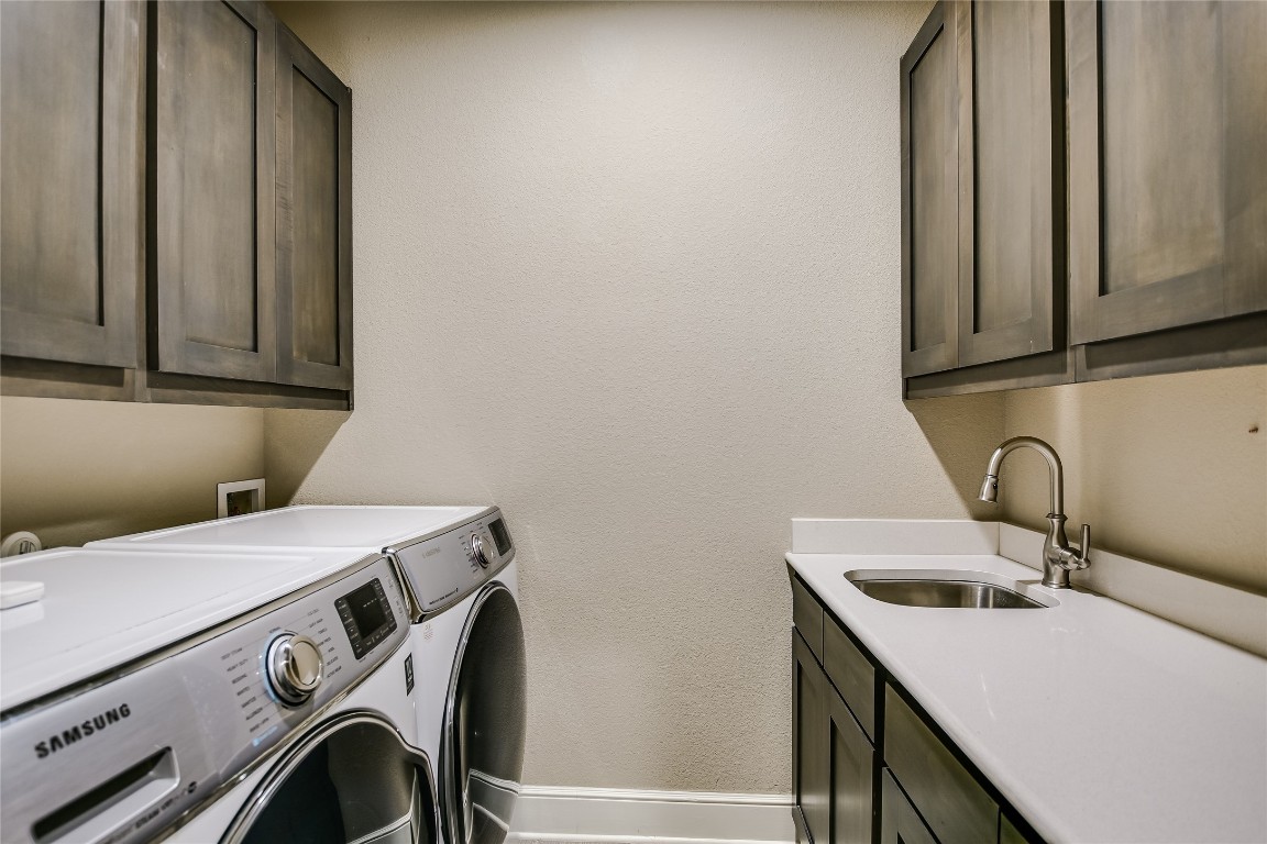 416 Cherokee Rose Circle Georgetown, TX 78626 - Photo 18 of 36 a utility room with dryer and washer