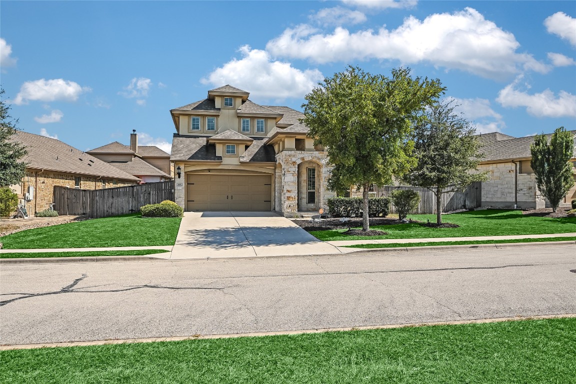 416 Cherokee Rose Circle Georgetown, TX 78626 - Photo 19 of 36 a front view of a house with a yard