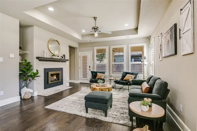 a living room with furniture and a fireplace