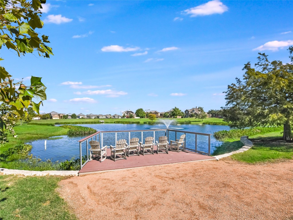 416 Cherokee Rose Circle Georgetown, TX 78626 - Photo 31 of 36 a view of a lake with a yard