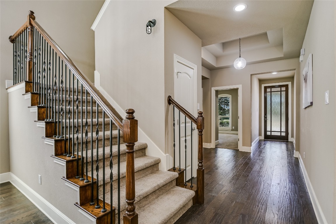 416 Cherokee Rose Circle Georgetown, TX 78626 - Photo 9 of 36 a view of staircase with wooden floor and white walls
