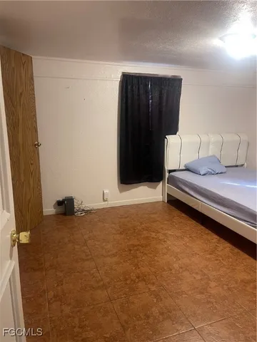 a bathroom with mirror and bathtub