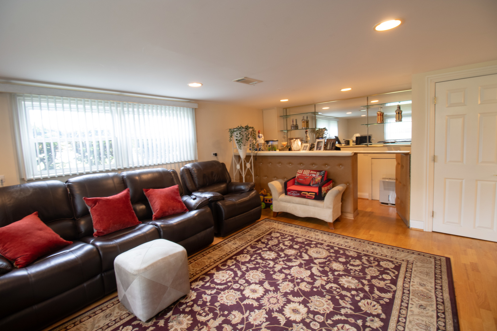 8662 North Merrill Street Niles, IL 60714 - Photo 20 of 27 a living room with furniture and a rug