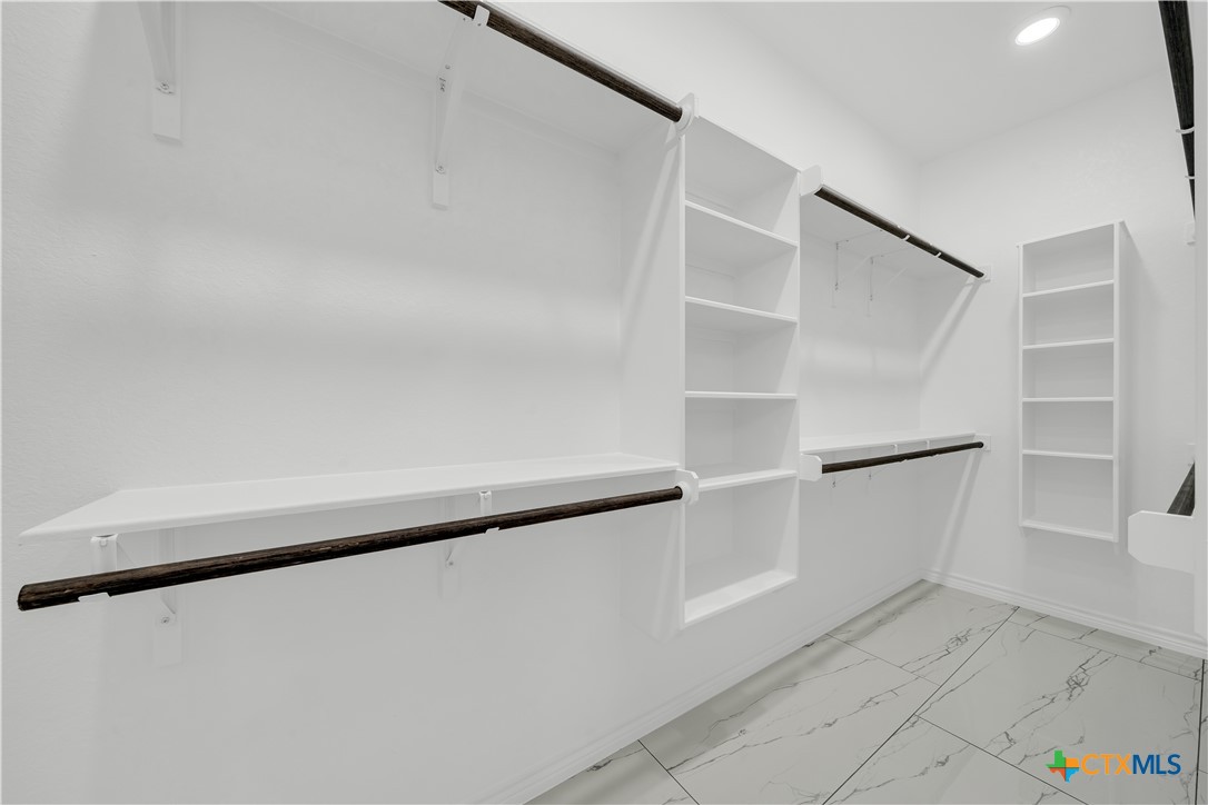816 County Road, Unit 6723 Natalia, TX 78059 - Photo 13 of 19 a view of an empty walk in closet