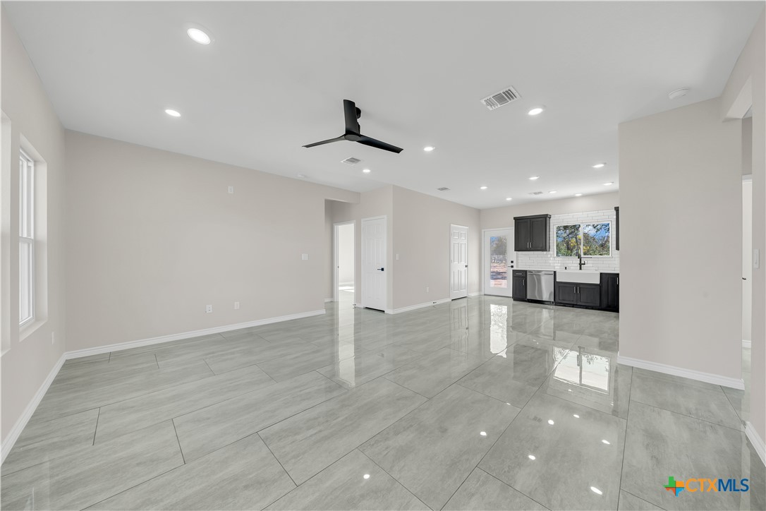 816 County Road, Unit 6723 Natalia, TX 78059 - Photo 2 of 19 a view of a kitchen with a sink and a stove top oven