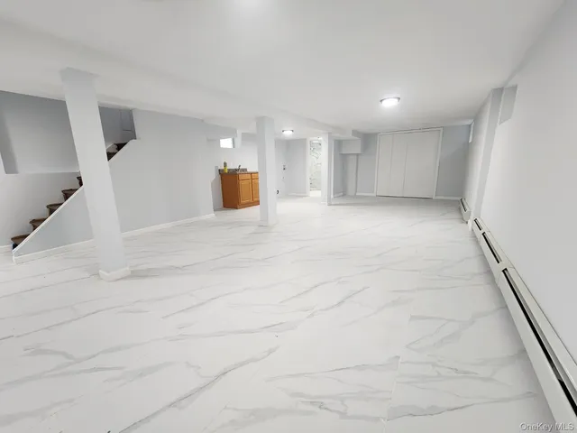 a view of a kitchen with a sink and a window