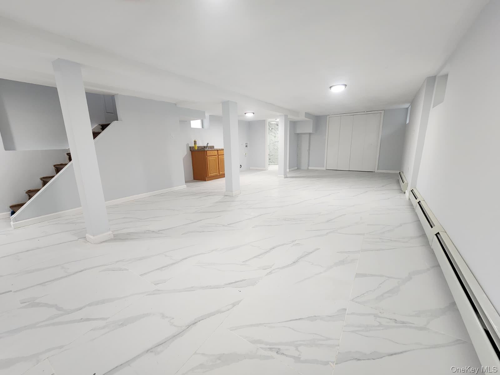 221-26 134th Road Queens, NY 11413 - Photo 12 of 30 a view of a kitchen with a sink and a window