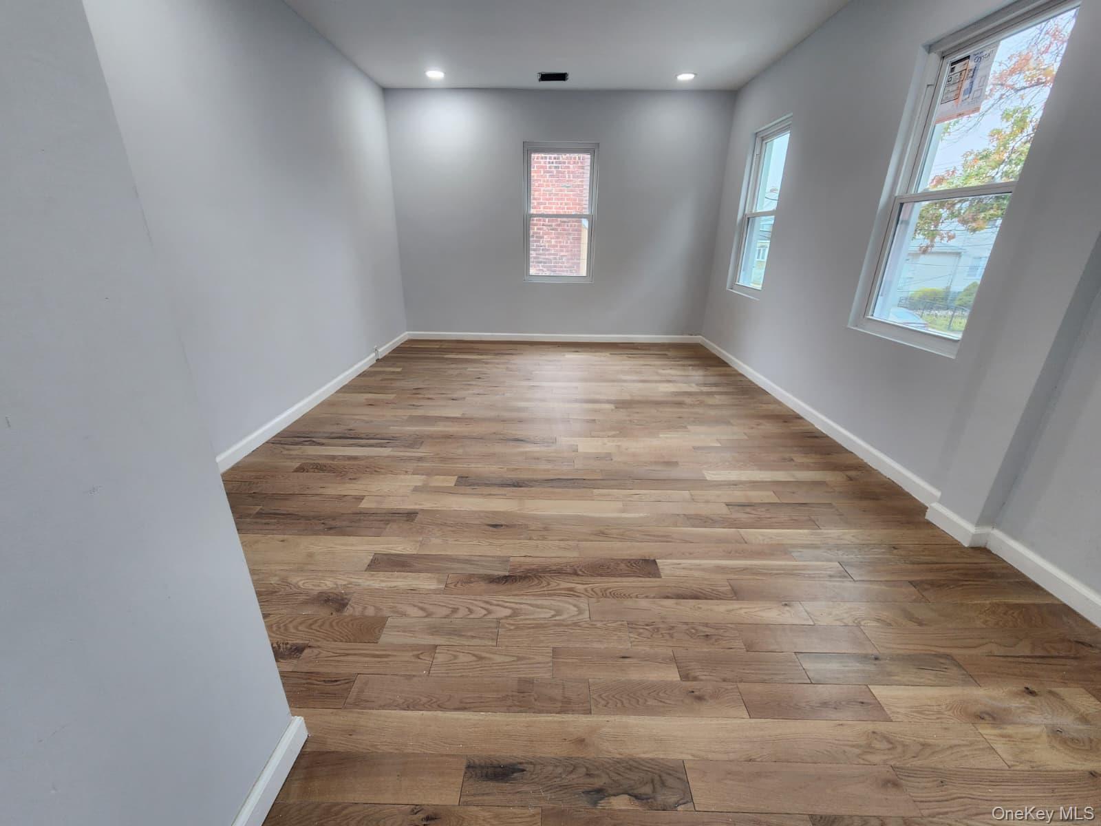 221-26 134th Road Queens, NY 11413 - Photo 22 of 30 an empty room with windows