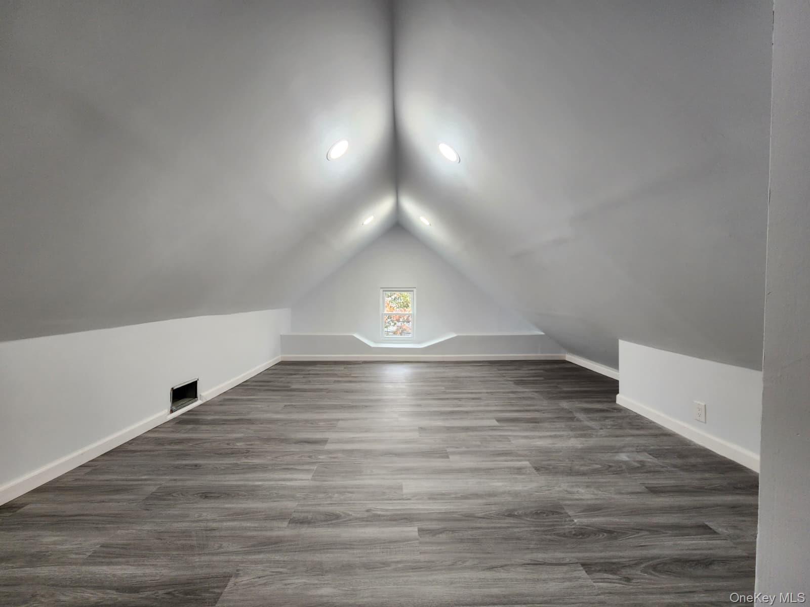 221-26 134th Road Queens, NY 11413 - Photo 25 of 30 a view of empty room with wooden floor