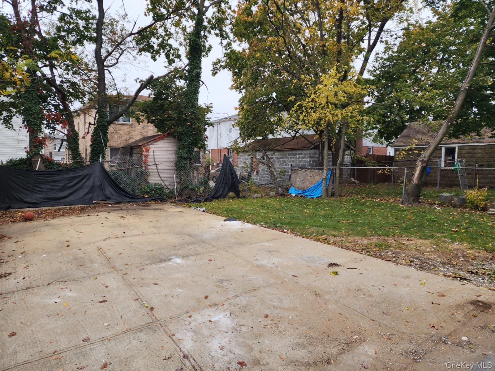 221-26 134th Road Queens, NY 11413 - Photo 29 of 30 a view of a house with a yard