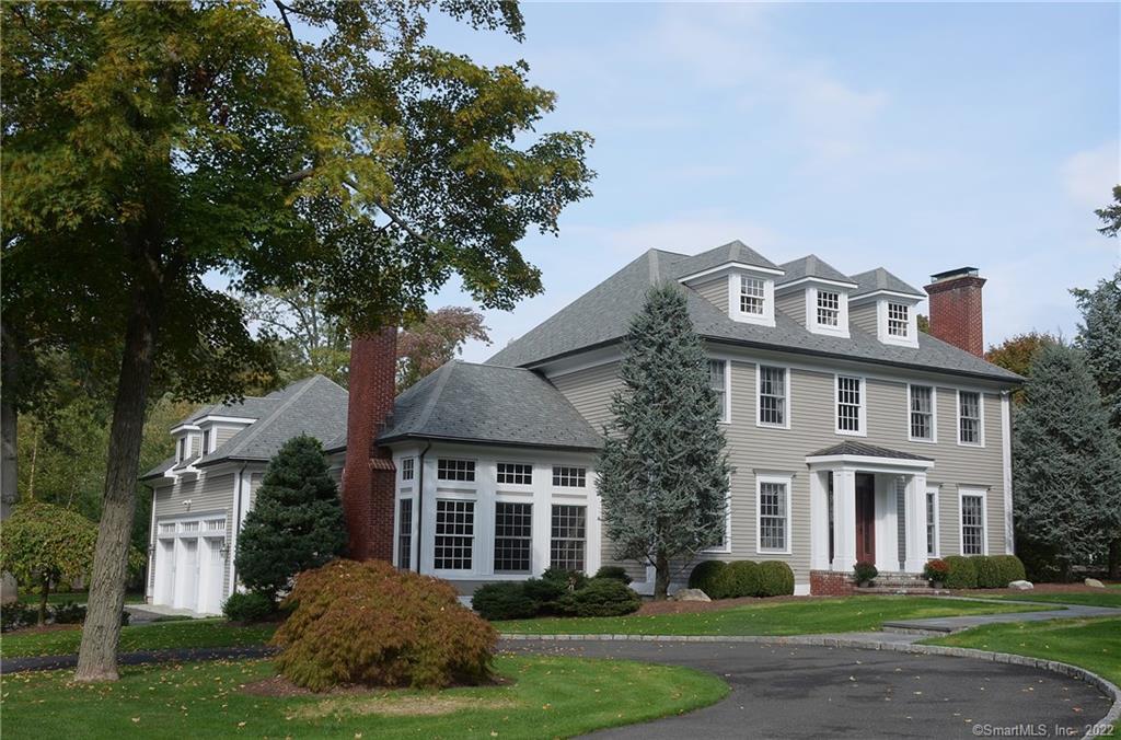 50 Peaceable Street Ridgefield, CT 06877 - Photo 1 of 1 a front view of a house with a garden
