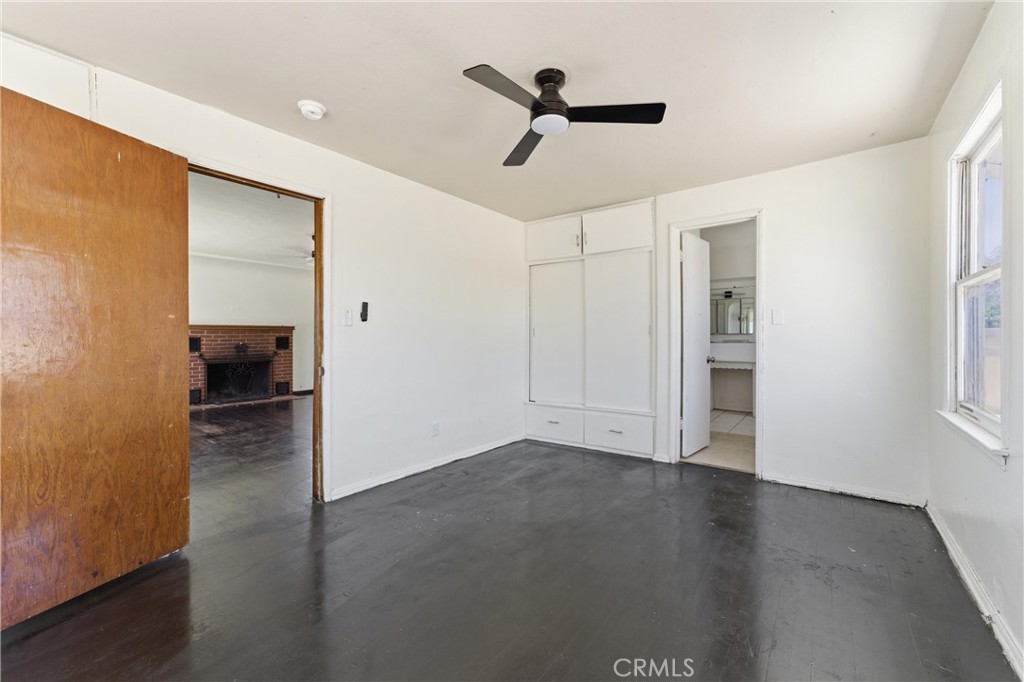 44509 Date Lancaster, CA 93534 - Photo 10 of 20 a view of empty room with wooden floor and fan