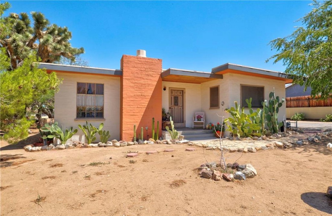 7559 Cherokee Trail Yucca Valley, CA 92284 - Photo 1 of 1 a view of a house with a yard