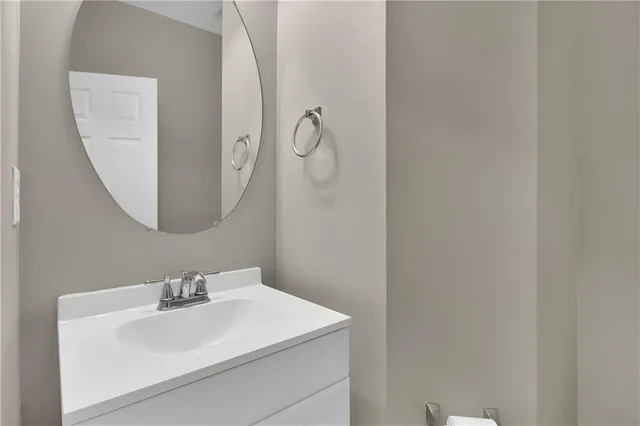 a bathroom with a sink and mirror