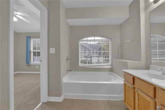 a bathroom with a bathtub and a sink