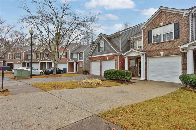 a view of a yard in front of a brick house
