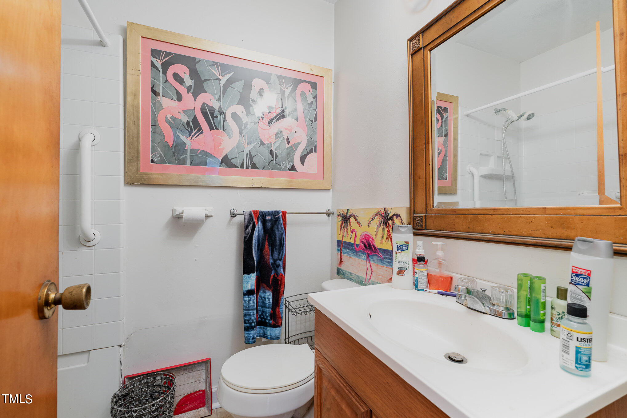 3628 Ridgecrest Avenue Fayetteville, NC 28303 - Photo 11 of 17 a bathroom with a sink a toilet and shower curtain