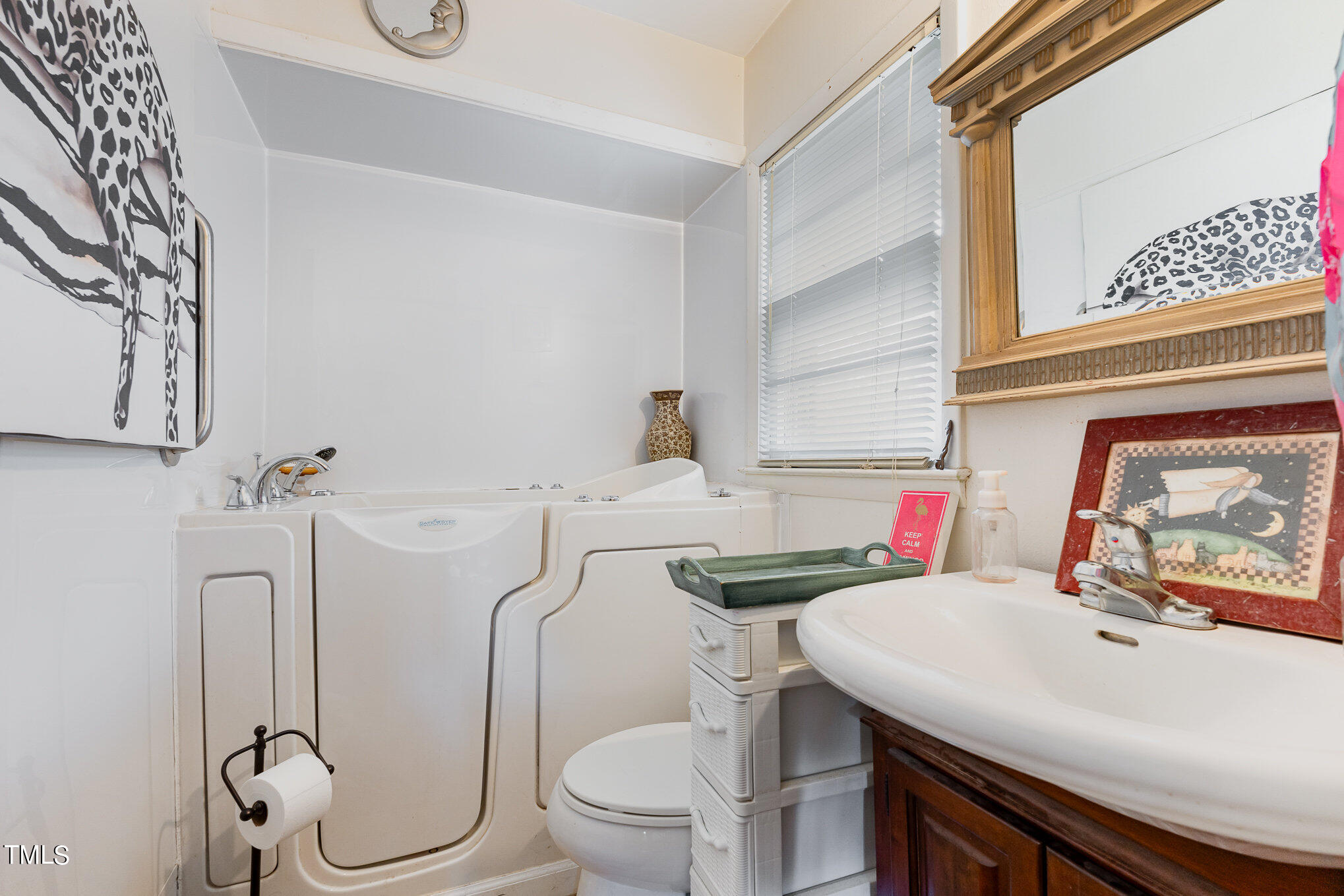 3628 Ridgecrest Avenue Fayetteville, NC 28303 - Photo 12 of 17 a bathroom with a sink toilet and a mirror