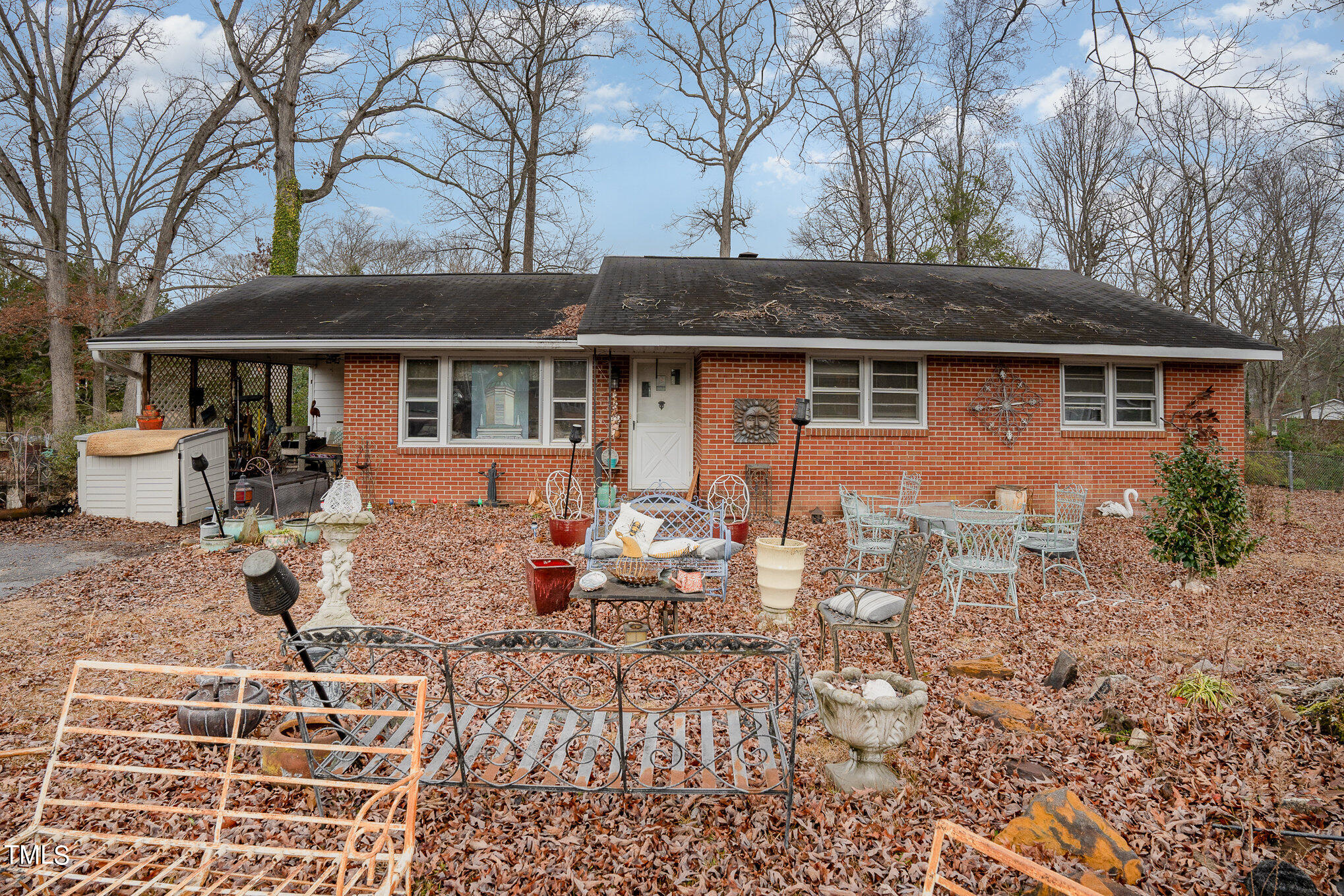 3628 Ridgecrest Avenue Fayetteville, NC 28303 - Photo 2 of 17 a front view of a house with garden