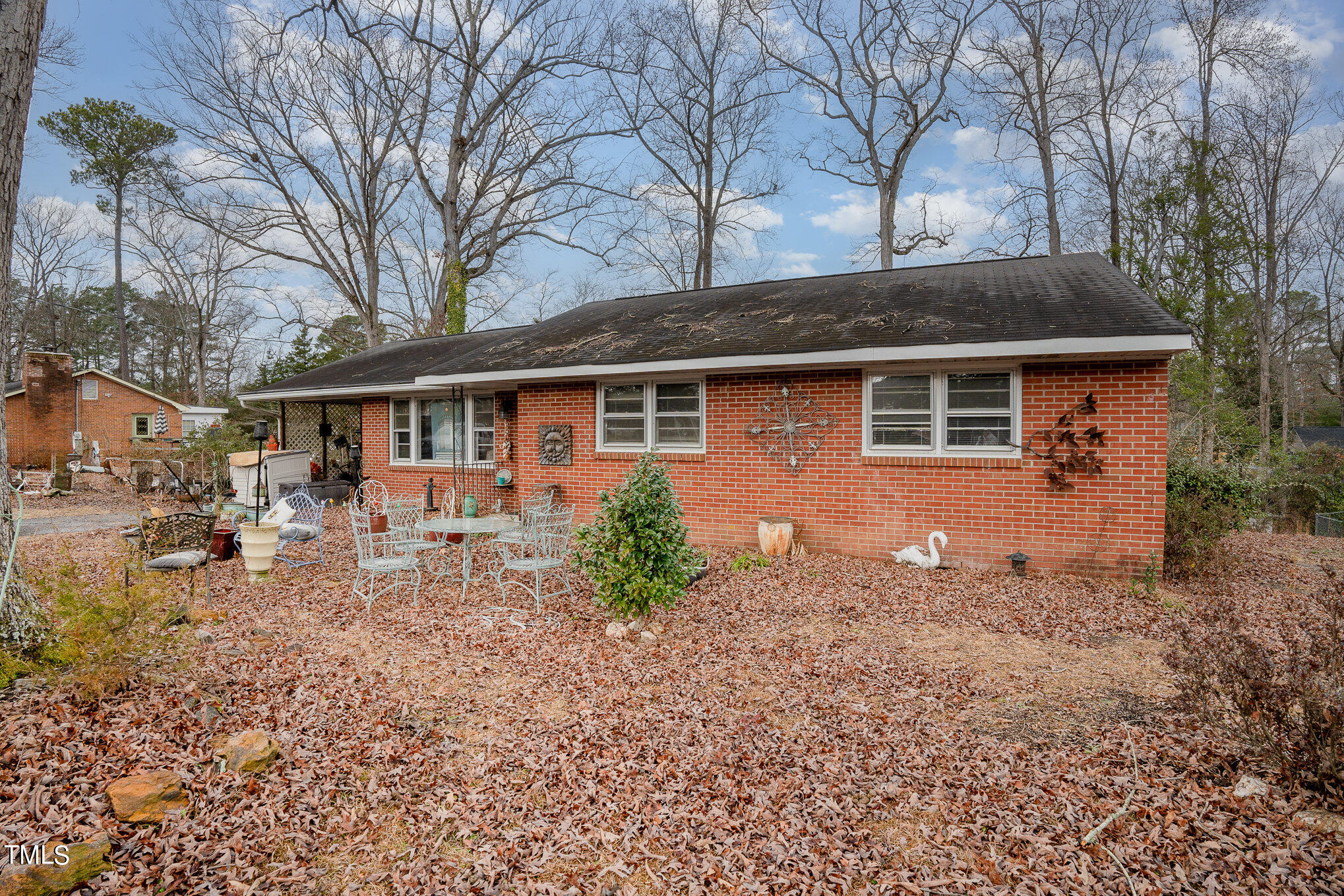 3628 Ridgecrest Avenue Fayetteville, NC 28303 - Photo 3 of 17 a view of a house with backyard and sitting area