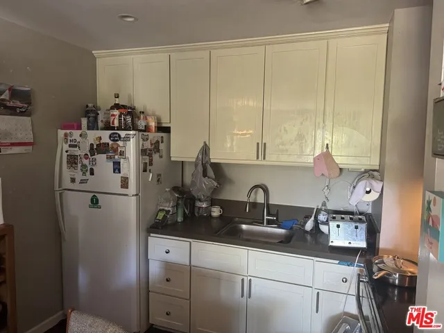 a kitchen with a stove and a microwave