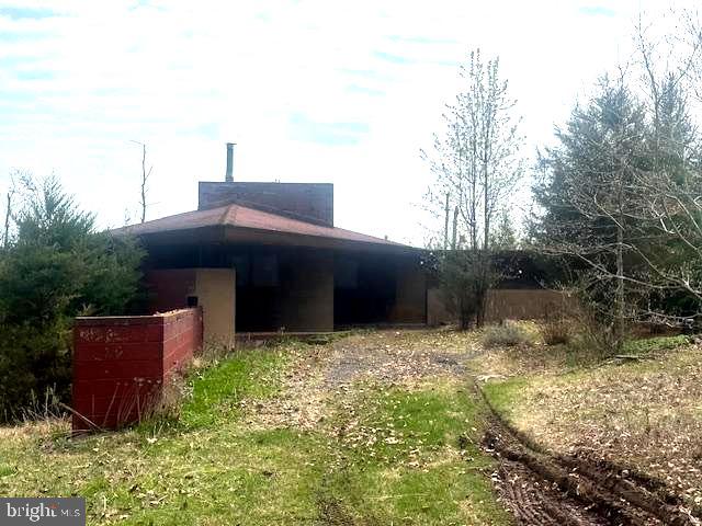 565 Cafferty Road Upper Black Eddy, PA 18972 - Photo 2 of 19 a backyard of a house with lots of green space