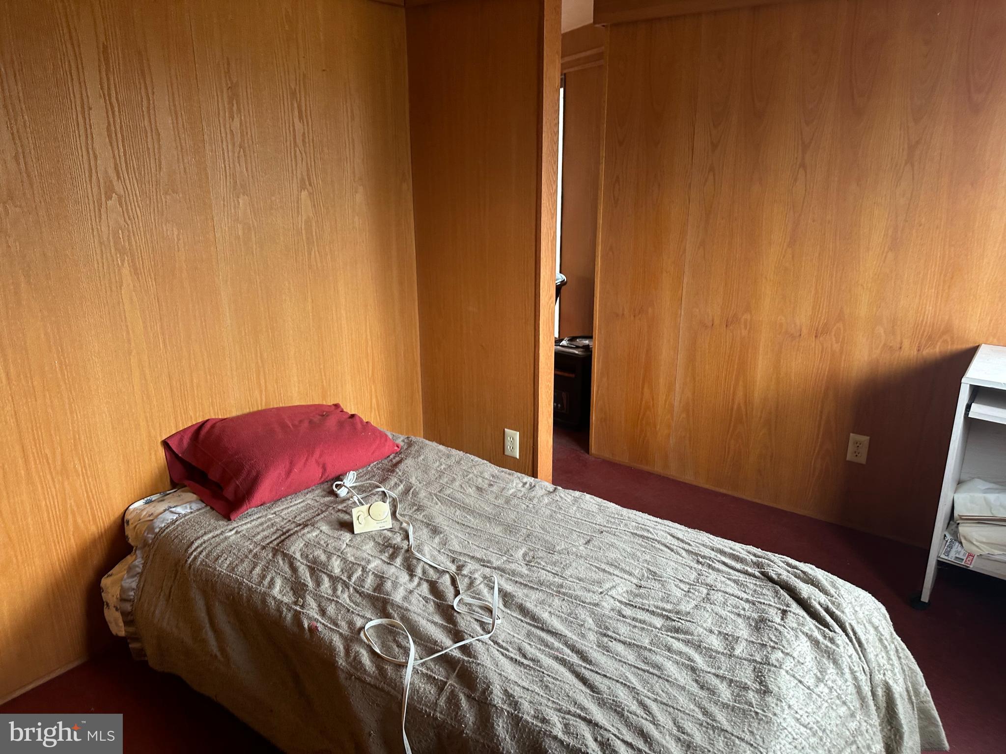 565 Cafferty Road Upper Black Eddy, PA 18972 - Photo 10 of 19 a bedroom with a bed and a mirror