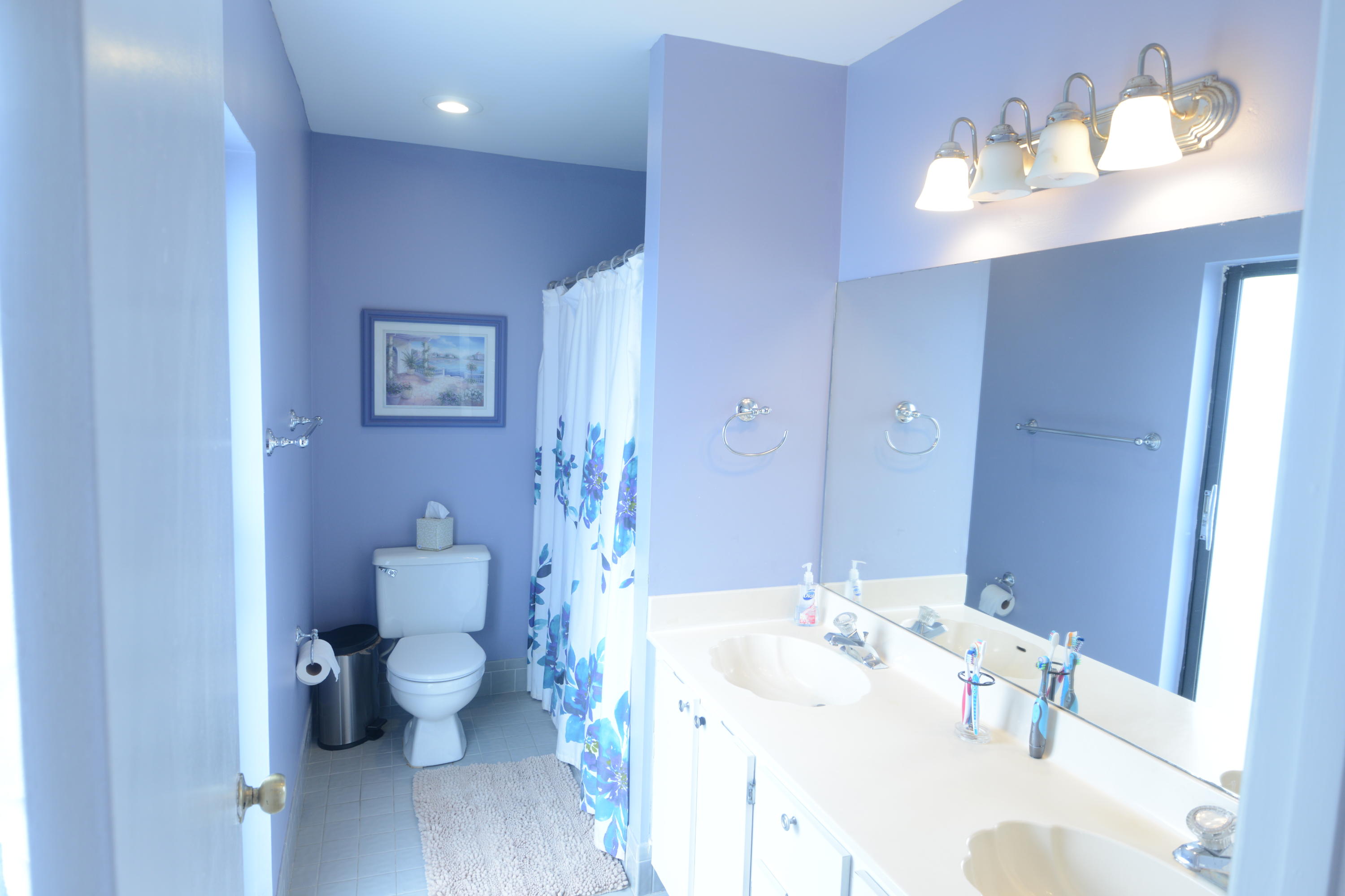 11885 Sunchase Court Boca Raton, FL 33498 - Photo 11 of 25 a bathroom with a sink and a mirror