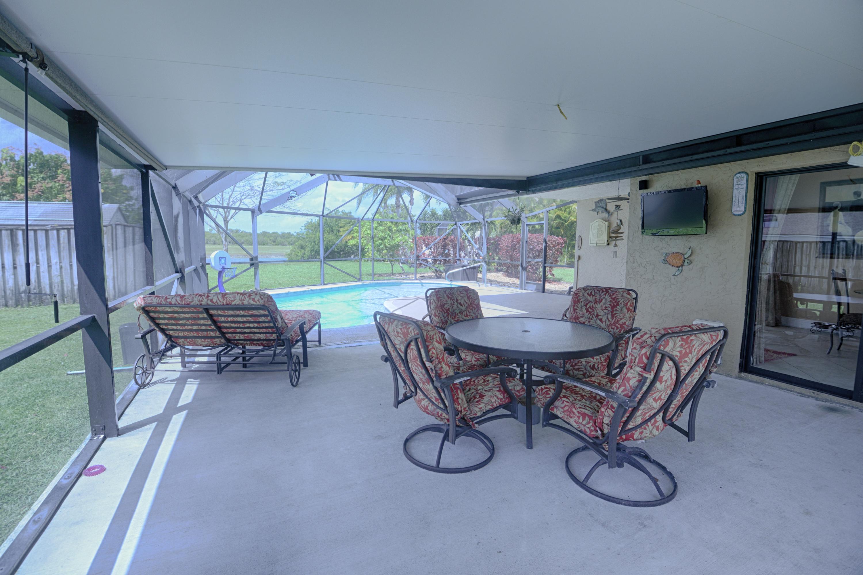 11885 Sunchase Court Boca Raton, FL 33498 - Photo 16 of 25 a view of a livingroom with furniture and a table