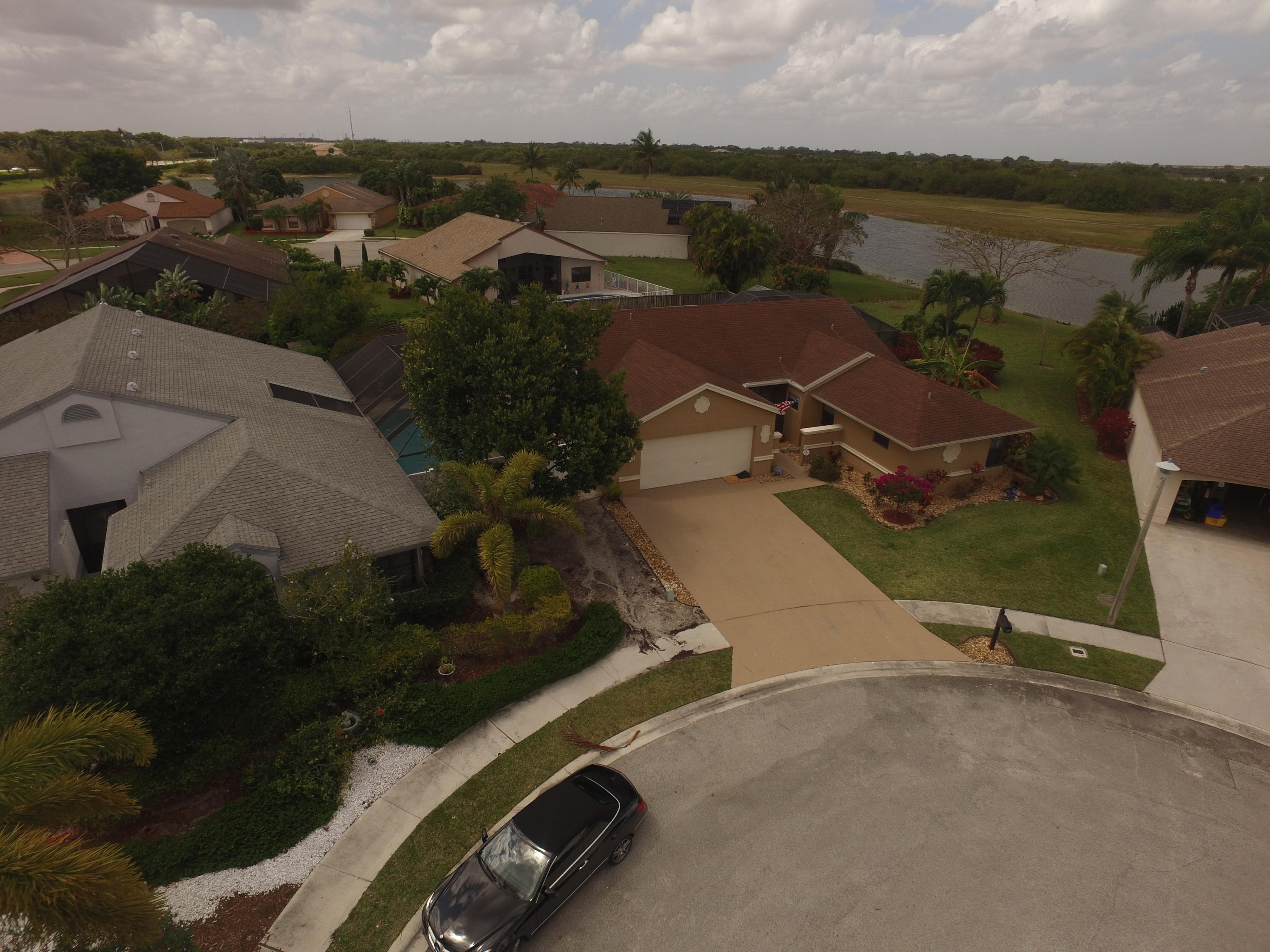 11885 Sunchase Court Boca Raton, FL 33498 - Photo 21 of 25 an aerial view of a residential houses with outdoor space