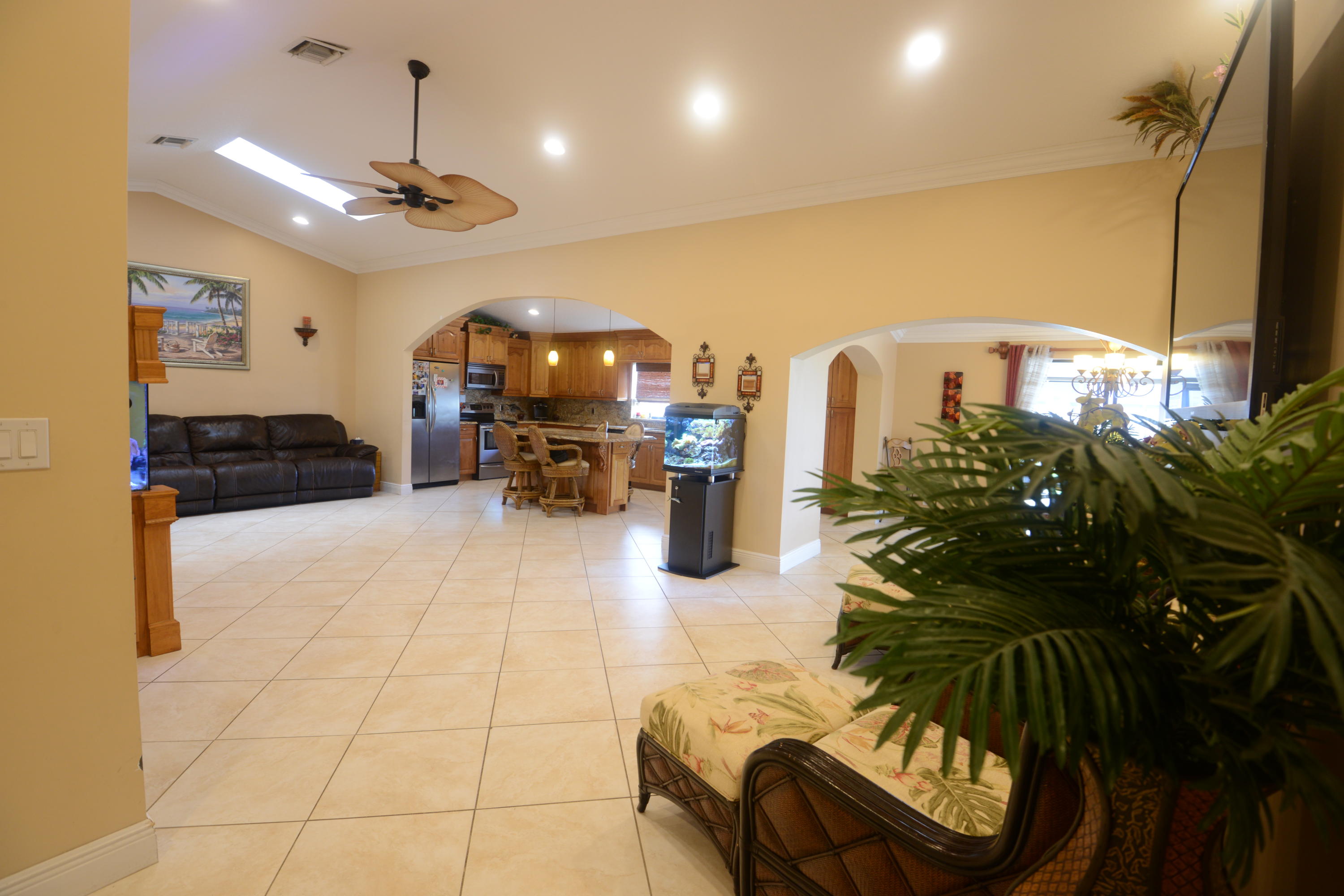 11885 Sunchase Court Boca Raton, FL 33498 - Photo 4 of 25 a living room with furniture and a chandelier