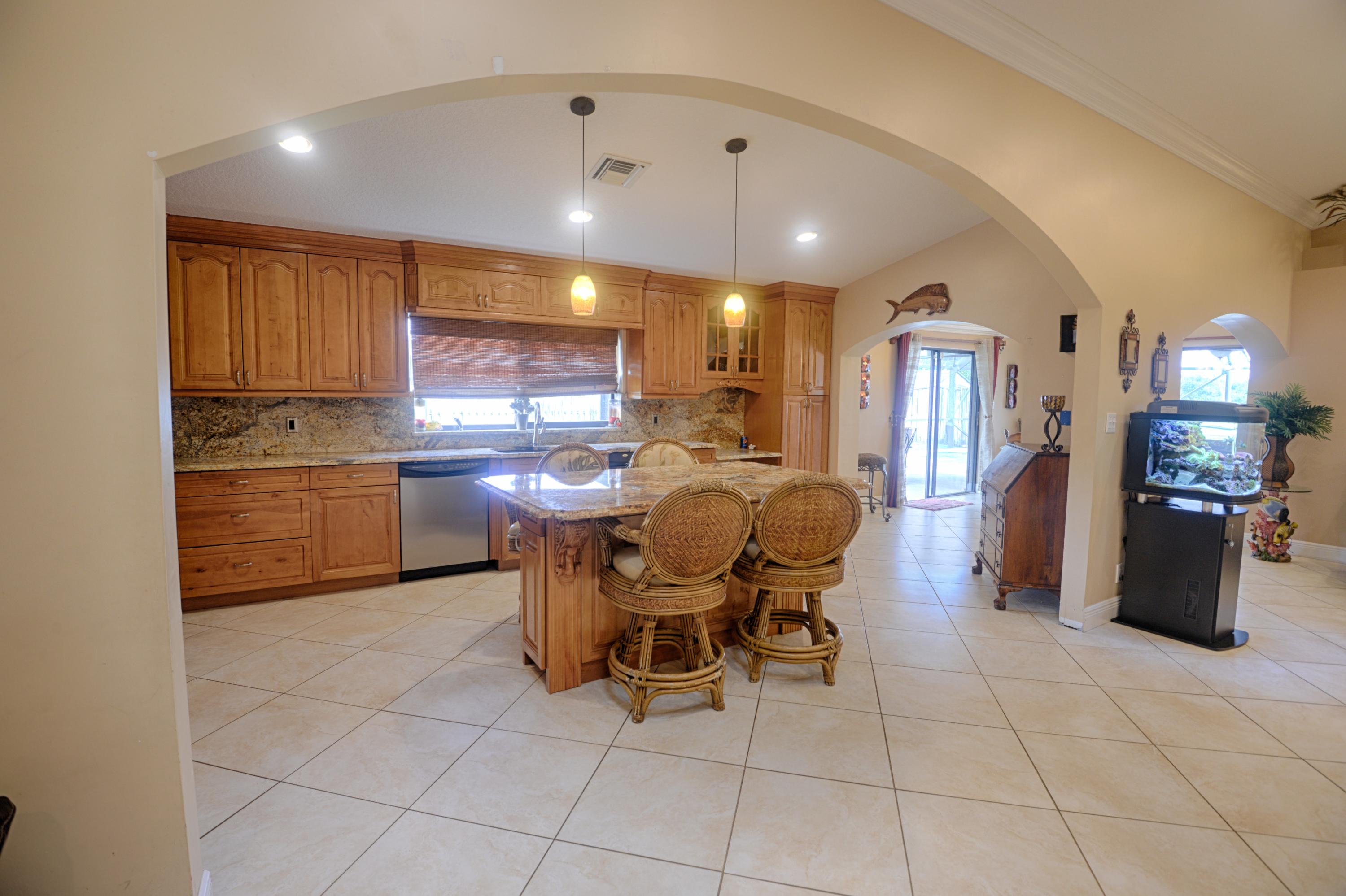 11885 Sunchase Court Boca Raton, FL 33498 - Photo 7 of 25 a view of a dining room with furniture