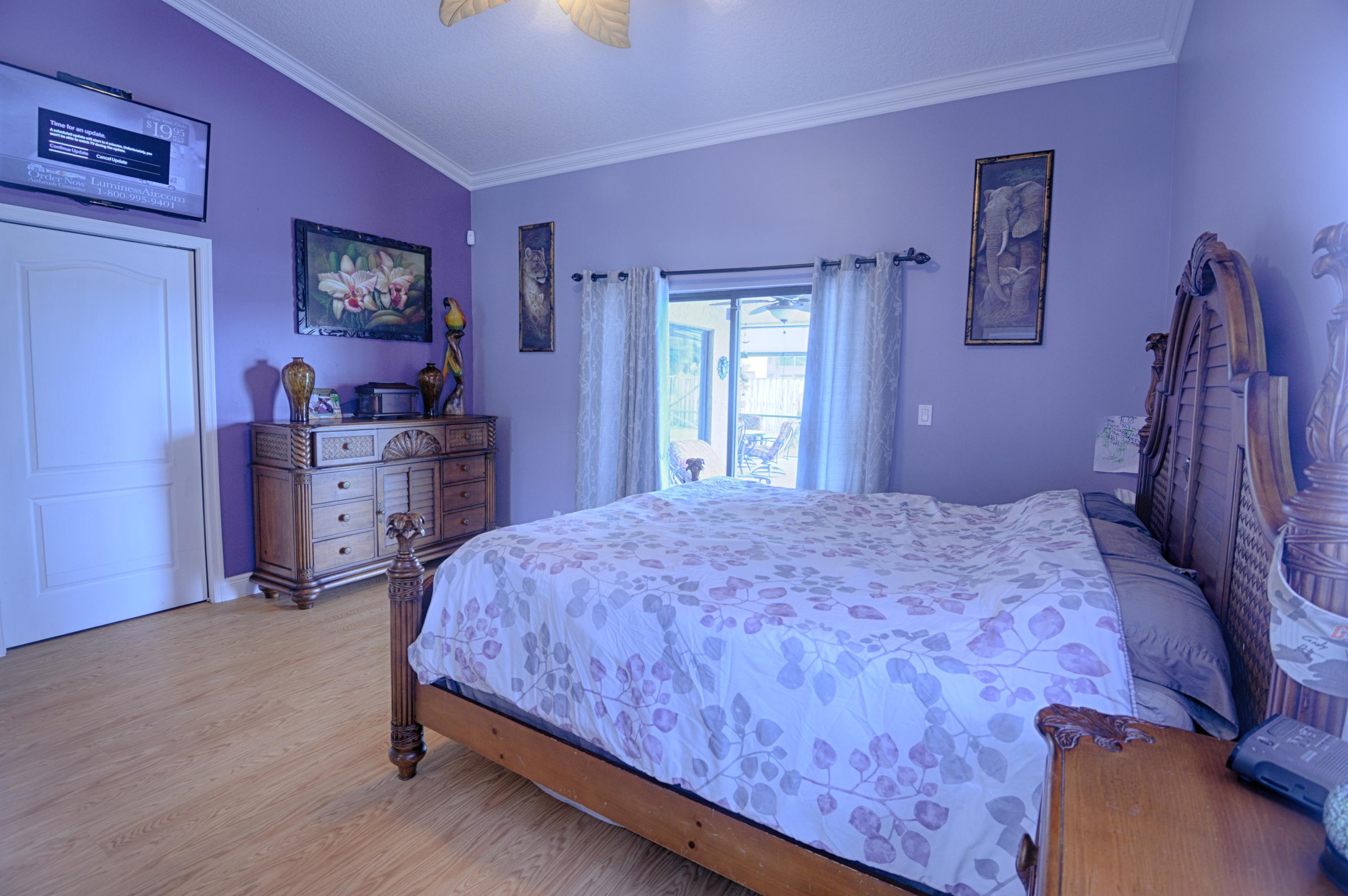 11885 Sunchase Court Boca Raton, FL 33498 - Photo 9 of 25 a bedroom with a bed and a dresser