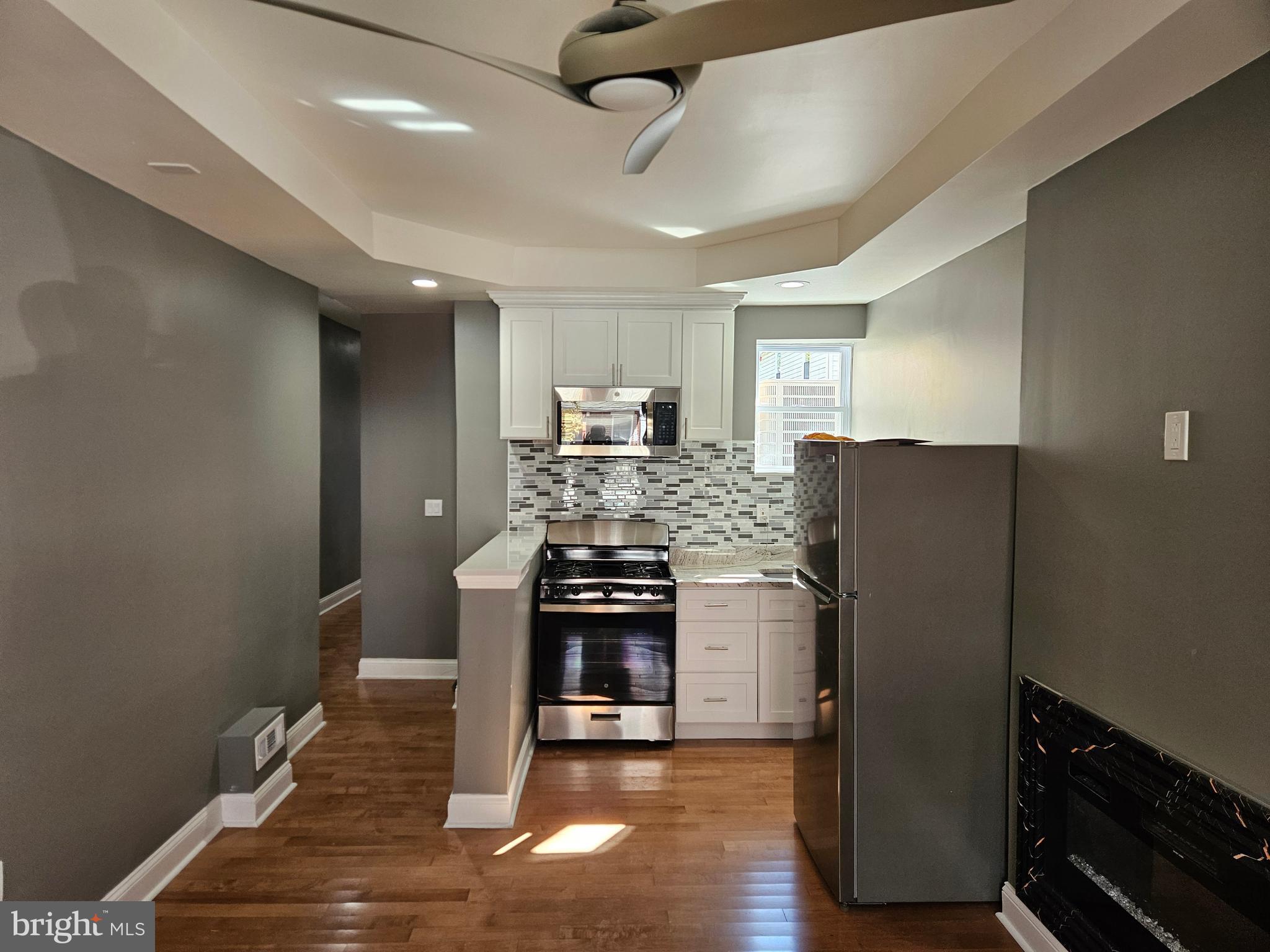 835 East State Street, Unit 1 Trenton, NJ 08609 - Photo 2 of 10 a kitchen with stainless steel appliances granite countertop a refrigerator and a stove top oven