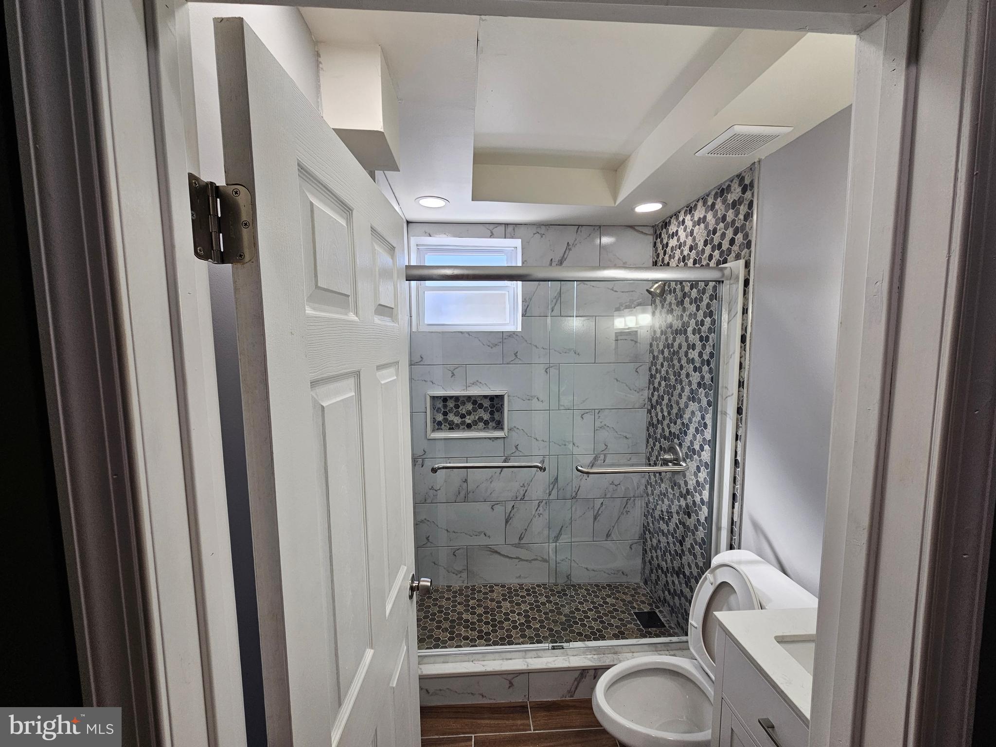 835 East State Street, Unit 1 Trenton, NJ 08609 - Photo 4 of 10 a bathroom with a shower a toilet and sink